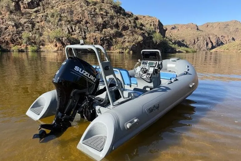 Slide: The Image of 2027 Tide Craft Custom Grey and Blue Catalina 13 boat on a scenic lake. - 8