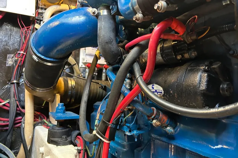Slide: The Image of Engine compartment of a 1995 Tiara Yachts 4000 Express with visible wiring and components. - 27