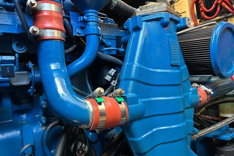 Slide: The Image of Close-up of a 1995 Tiara Yachts 4000 Express engine with blue and red components. - 28