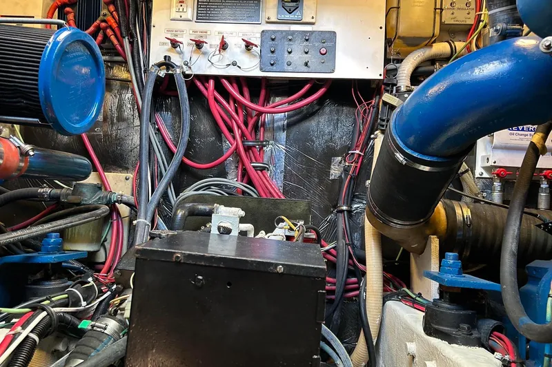 Slide: The Image of Engine room of a 1995 Tiara Yachts 4000 Express with complex wiring and components. - 29