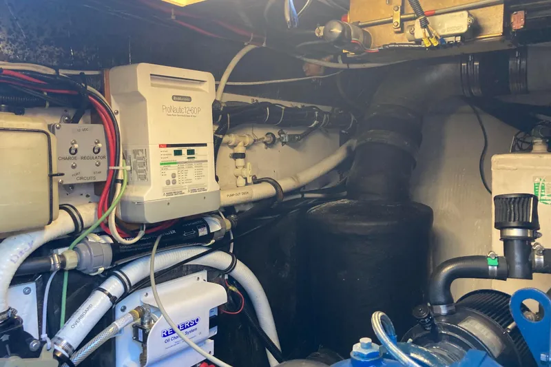 Slide: The Image of Engine room of a 1995 Tiara Yachts 4000 Express, showcasing electrical and mechanical components. - 31
