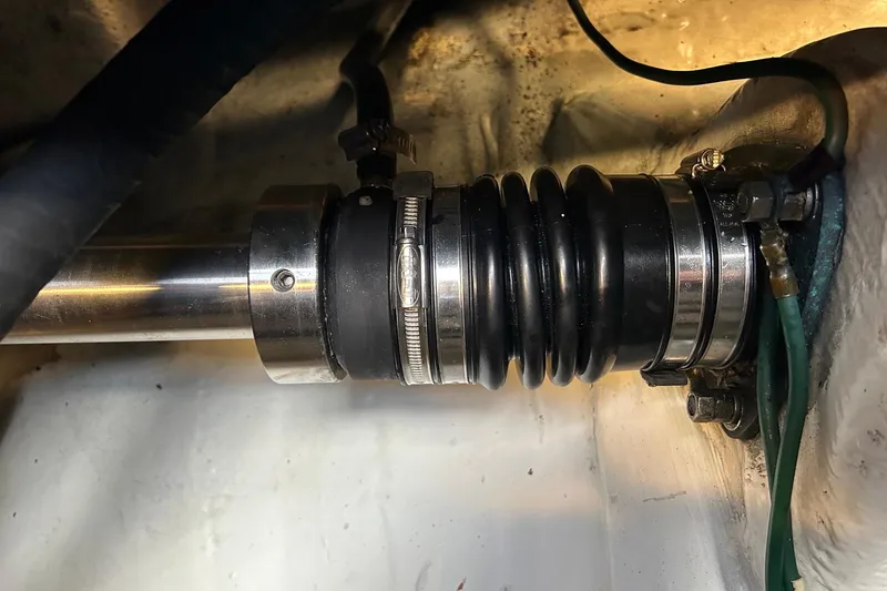 Slide: The Image of Close-up of a 1995 Tiara Yachts 4000 Express shaft seal with clamps and hoses. - 32