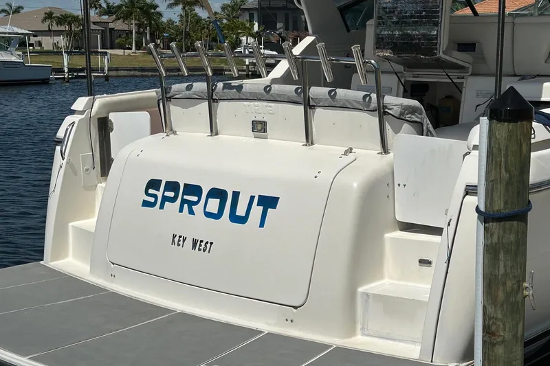 Slide: The Image of 1995 Tiara Yachts 4000 Express docked, featuring "Sprout" name and Key West location. - 35