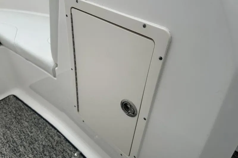 Slide: The Image of Storage compartment on a 2018 Chaparral 19 H2O Sport boat interior. - 12