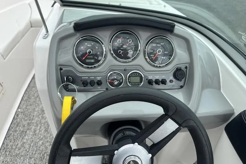 Slide: The Image of Dashboard of a 2018 Chaparral 19 H2O Sport boat with steering wheel and gauges. - 15