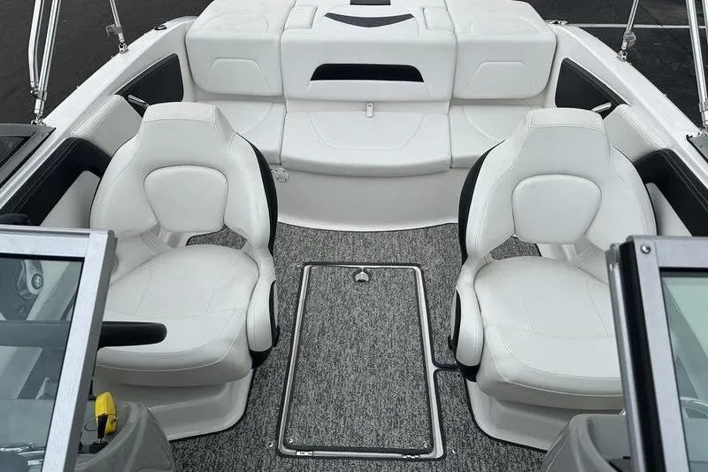 Slide: The Image of Interior of 2018 Chaparral 19 H2O Sport boat with white seating and gray carpet. - 17