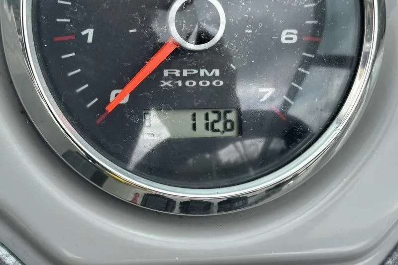 Slide: The Image of Tachometer displaying 1126 RPM on a 2018 Chaparral 19 H2O Sport boat. - 3