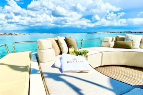Slide: The Image of Luxurious Gianetti 86 Motoryacht deck with plush seating, ocean view, and clear skies. - 9