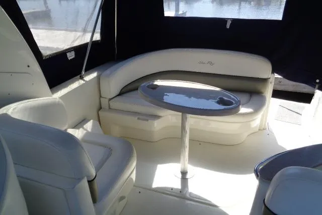 Slide: The Image of Interior of 2005 Sea Ray Sundancer 260 with seating and table. - 11