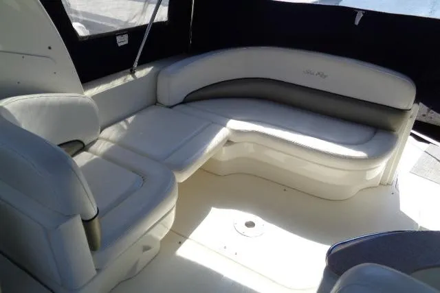 Slide: The Image of 2005 Sea Ray Sundancer 260 interior with white leather seating. - 13