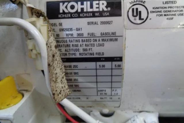 Slide: The Image of Kohler generator label on 2005 Sea Ray Sundancer 260, model 5E, gasoline-powered. - 25
