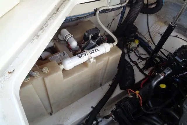 Slide: The Image of Engine compartment of a 2005 Sea Ray Sundancer 260 boat, showing mechanical components. - 27