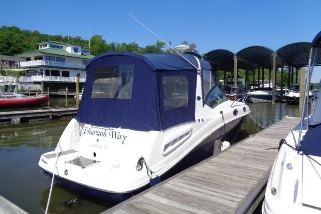 Slide: The Image of 2005 Sea Ray Sundancer 260 docked at marina with blue canopy. - 3