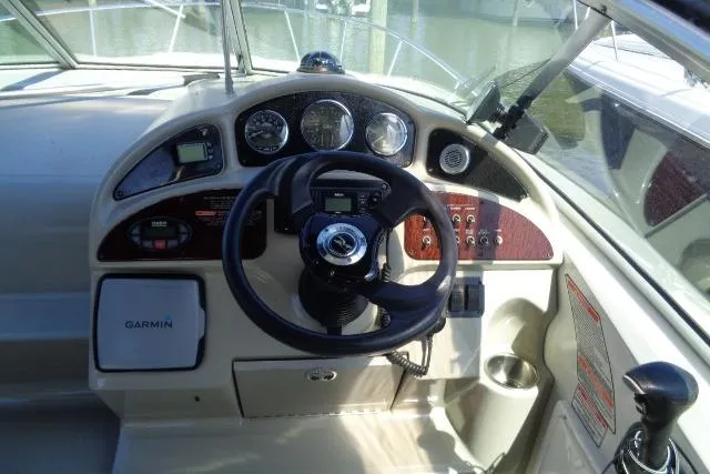 Slide: The Image of Cockpit of 2005 Sea Ray Sundancer 260 with Garmin navigation system and steering wheel. - 5