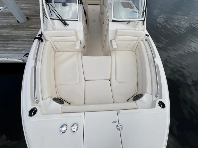 Slide: The Image of The image shows the cockpit of a 2027 Grady-White Freedom 285 with beige upholstery. - 22