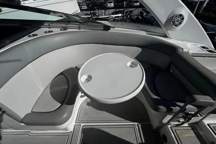 Slide: The Image of 2005 Cobalt 360 Cruiser interior with round table and cushioned seating. - 10