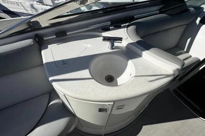 Slide: The Image of 2005 Cobalt 360 Cruiser interior with a sleek sink and countertop design. - 11
