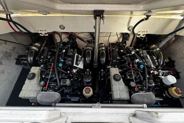 Slide: The Image of Engine compartment of a 2005 Cobalt 360 Cruiser, showcasing dual engines and mechanical components. - 21