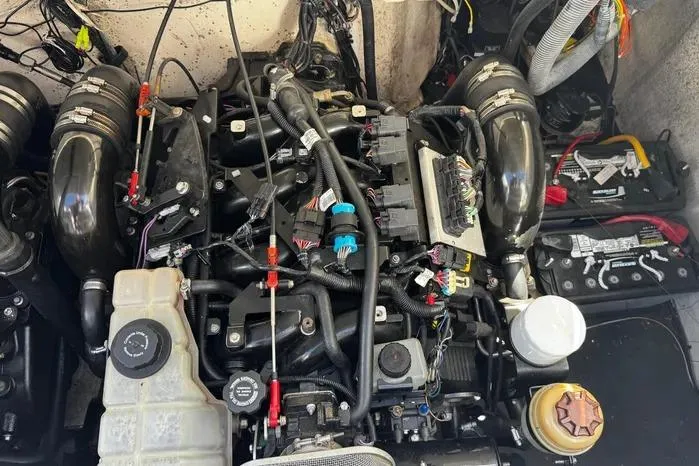 Slide: The Image of Engine compartment of a 2005 Cobalt 360 Cruiser with visible components and wiring. - 22