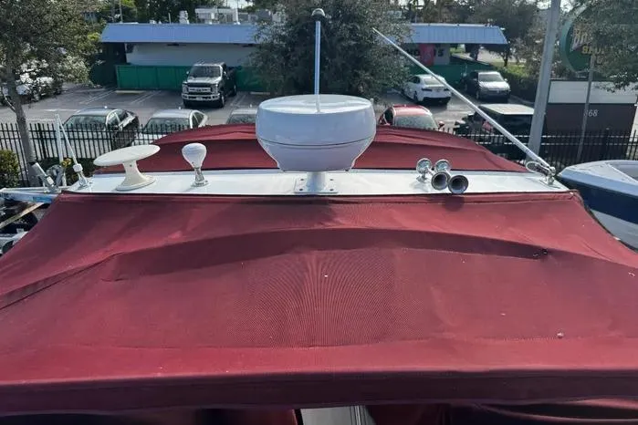 Slide: The Image of 2005 Cobalt 360 Cruiser with red canopy and radar equipment. - 3