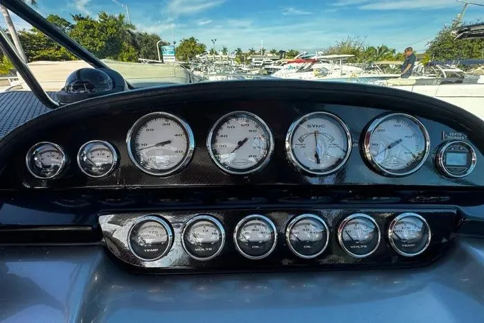Slide: The Image of Dashboard of a 2005 Cobalt 360 Cruiser with multiple gauges and controls. - 4