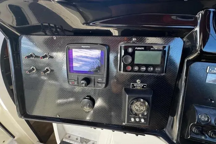 Slide: The Image of Control panel of a 2005 Cobalt 360 Cruiser with navigation and audio systems. - 5