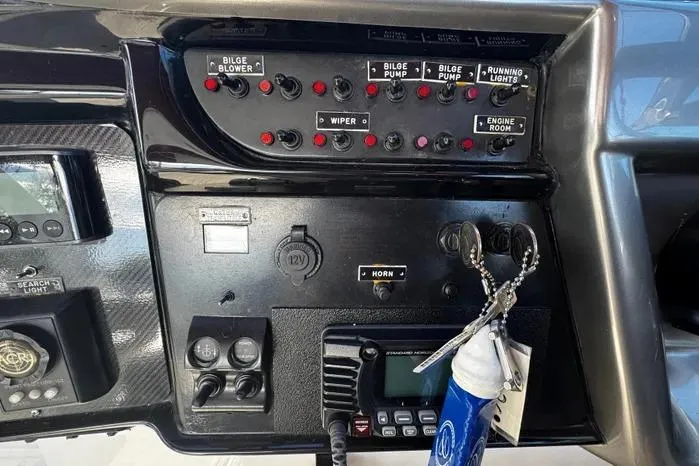 Slide: The Image of Control panel of a 2005 Cobalt 360 Cruiser with switches and radio equipment. - 6