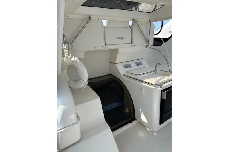 Slide: The Image of 1996 Silverton 442 Cockpit Motor Yacht interior with sink and storage. - 12