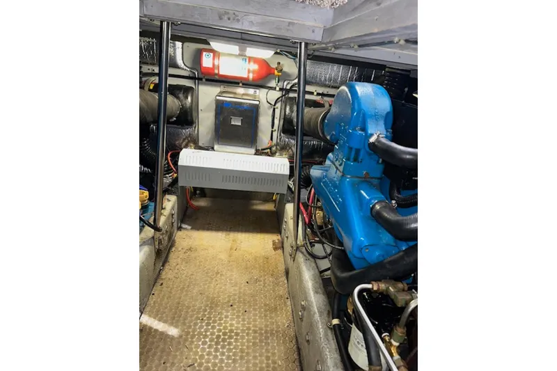 Slide: The Image of Engine room of 1996 Silverton 442 Cockpit Motor Yacht with visible machinery and equipment. - 29
