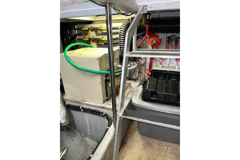 Slide: The Image of Engine room of 1996 Silverton 442 Cockpit Motor Yacht with equipment and wiring. - 30