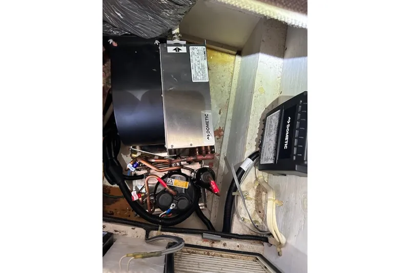 Slide: The Image of Engine compartment of a 1996 Silverton 442 Cockpit Motor Yacht with Dometic equipment. - 32