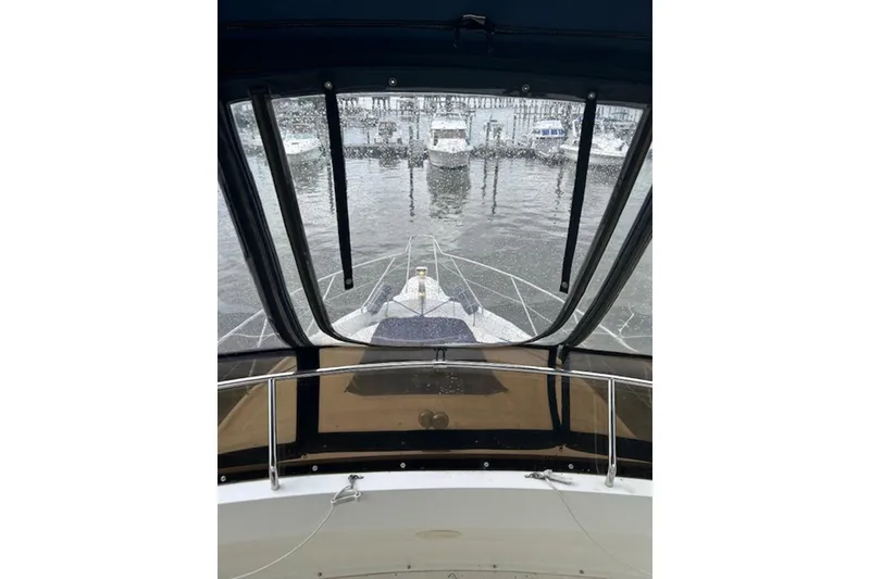 Slide: The Image of View from 1996 Silverton 442 Cockpit Motor Yacht, overlooking marina through cockpit windows. - 6
