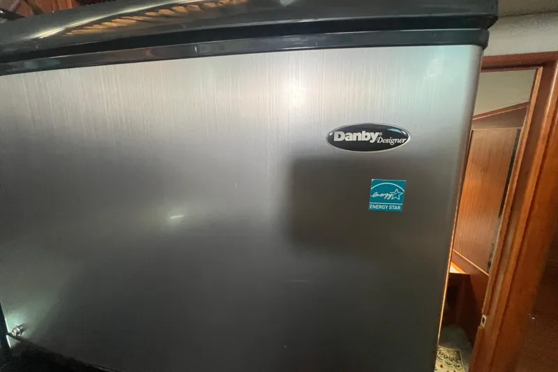 Slide: The Image of Danby Designer fridge with Energy Star label inside 1987 Sea Ray 410 Aft Cabin. - 15