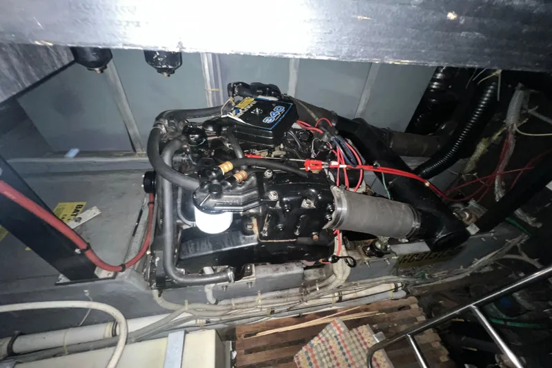 Slide: The Image of Engine compartment of a 1987 Sea Ray 410 Aft Cabin boat, showcasing mechanical components. - 22