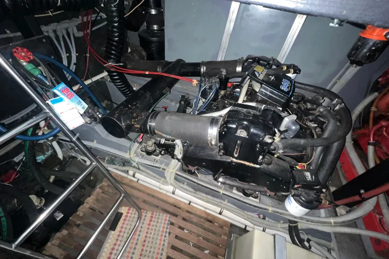 Slide: The Image of Engine room of 1987 Sea Ray 410 Aft Cabin with visible mechanical components. - 23
