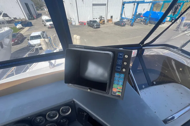 Slide: The Image of Cockpit view of 1987 Sea Ray 410 Aft Cabin with navigation equipment. - 8