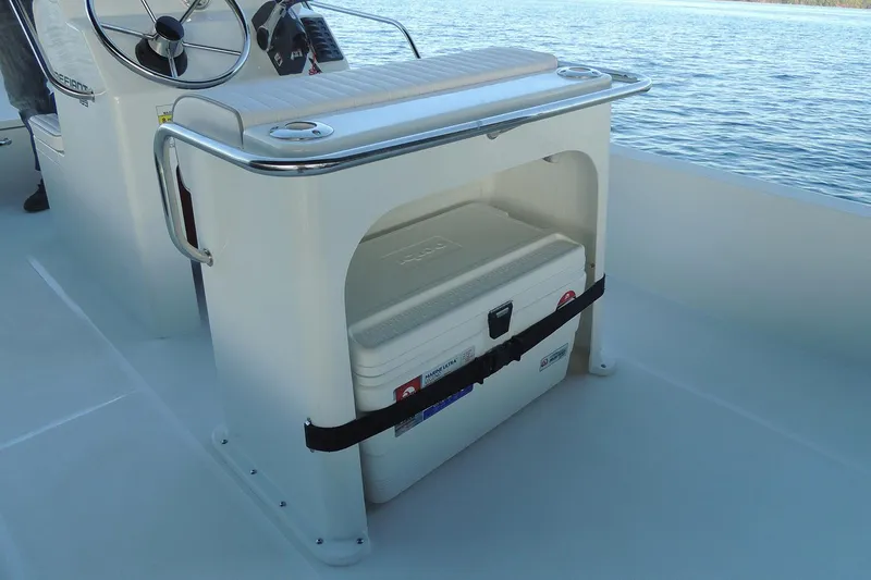 Slide: The Image of Manufacturer Provided Image: Maritime 189 Defiant 2026 boat with steering console and cooler. - 11