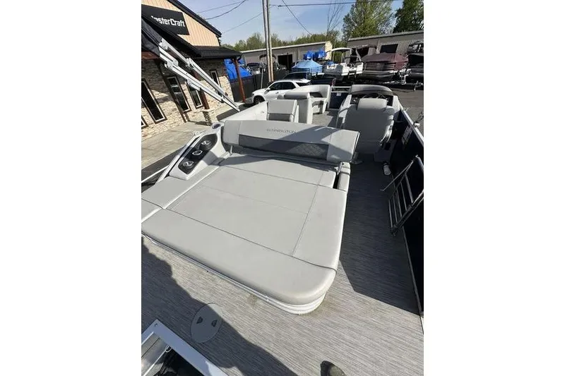 Slide: The Image of 2022 Bennington 22 L pontoon boat with spacious seating and modern design. - 16