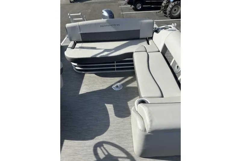 Slide: The Image of 2022 Bennington 22 L boat interior with gray seating and modern design. - 5