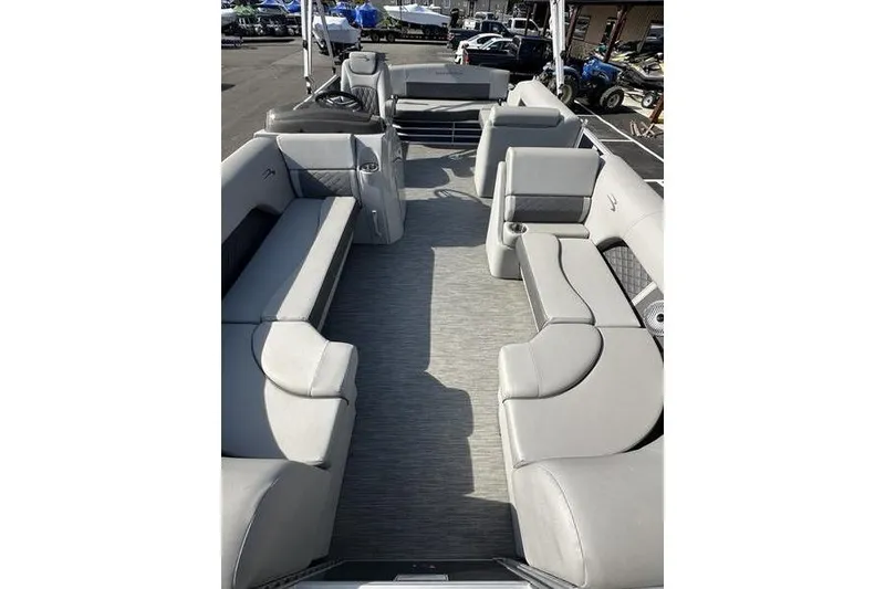 Slide: The Image of 2022 Bennington 22 L pontoon boat interior with spacious seating and modern design. - 6