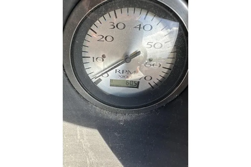 Slide: The Image of Close-up of a 2022 Bennington 22 L RPM gauge displaying 605 RPM. - 7