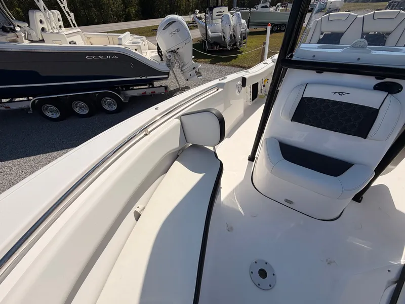 Slide: The Image of Interior view of a 2022 Tidewater 220 LXF boat with seating area. - 11