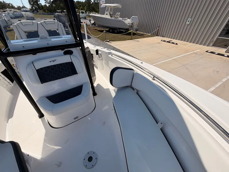 Slide: The Image of Interior view of a 2022 Tidewater 220 LXF boat with seating area. - 12