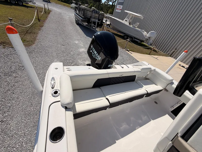 Slide: The Image of 2022 Tidewater 220 LXF boat with Yamaha engine, displayed on parking lot. - 14
