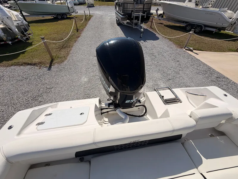 Slide: The Image of Rear view of a 2022 Tidewater 220 LXF boat with outboard motor. - 15