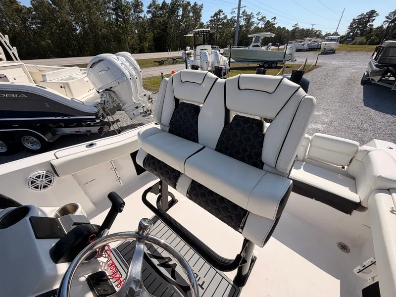 Slide: The Image of Interior view of a 2022 Tidewater 220 LXF boat with luxurious seating. - 19