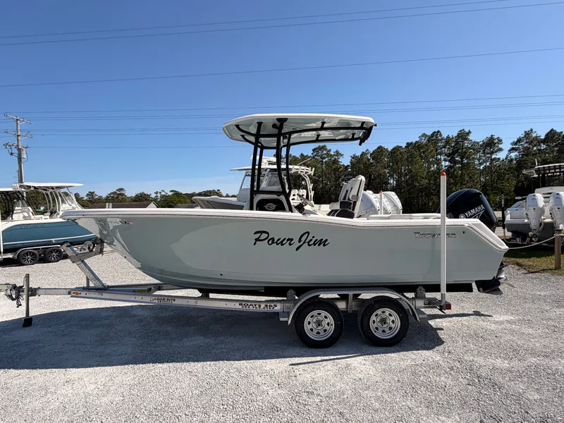Slide: The Image of 2022 Tidewater 220 LXF boat on trailer outdoors. - 5