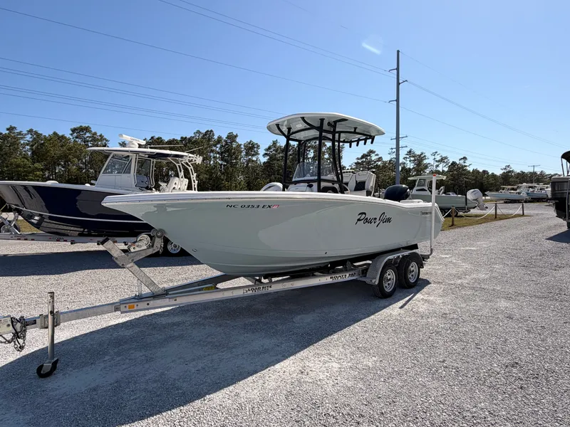 Slide: The Image of 2022 Tidewater 220 LXF boat on trailer outdoors. - 6