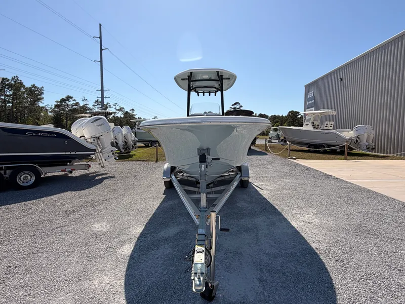 Slide: The Image of 2022 Tidewater 220 LXF boat on trailer under sunny sky. - 7