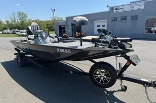 Slide: The Image of 2021 G3 Sportsman 1810 boat on trailer, parked outdoors near a building. - 14